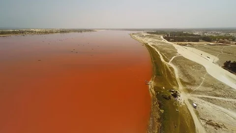 Aerial view over the river, having unusual red color and stretching far to the Video stock 121778134