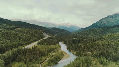 Aerial view over a river through a valley Video stock 154552252