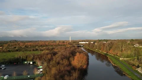Aerial View over River with Trees and Building in Carlow, Irelands Stock Footage 301228104