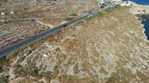 Aerial View Over Road To Ghar Lapsi With Car Park For Visitors In The 動画素材 230897342