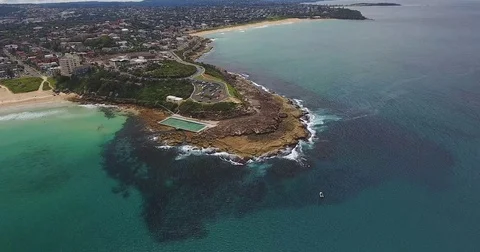 Aerial view over rock pool and underwater reef coastal residential area Stock Footage 70825064