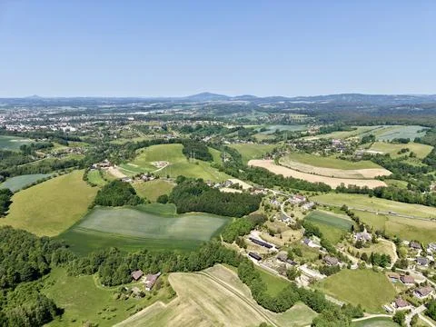 Aerial view over rolling fields and village Stock Photos
