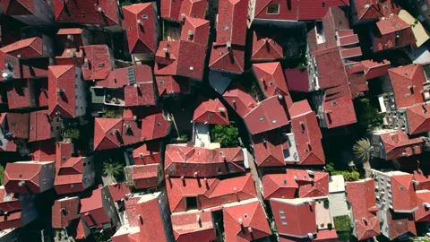 Aerial View over the roofs Of Budva Old Town Tower And Pier, Montenegro Video stock 230100749