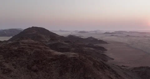 Aerial View Over Rugged Red Granite Mountains in the Namib Desert, Namibia Stock Footage 339439656