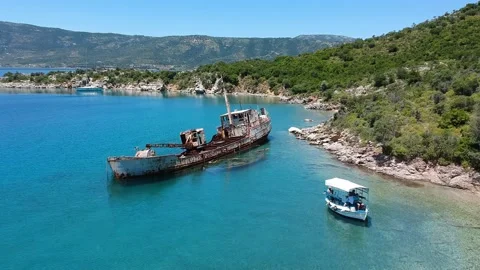 Aerial view over rusty shipwreck of an old cargo boat at Peristera island nea Stock Footage 201449118