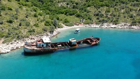 Aerial view over rusty shipwreck of an old cargo boat at Peristera island nea Stock Footage 201449315