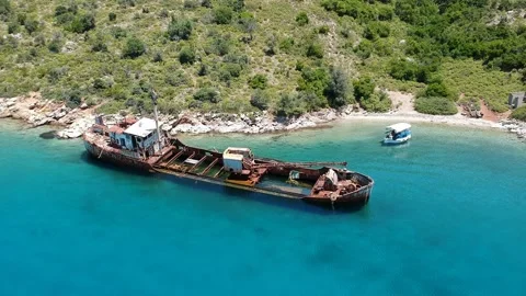 Aerial view over rusty shipwreck of an old cargo boat at Peristera island nea Stock Footage 201449435
