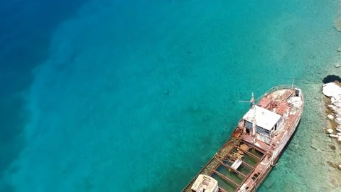 Aerial view over rusty shipwreck of an old cargo boat at Peristera island nea Stock Footage 201453835