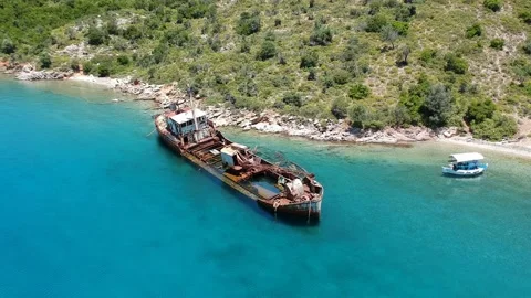 Aerial view over rusty shipwreck of an old cargo boat at Peristera island nea Stock Footage 201466003
