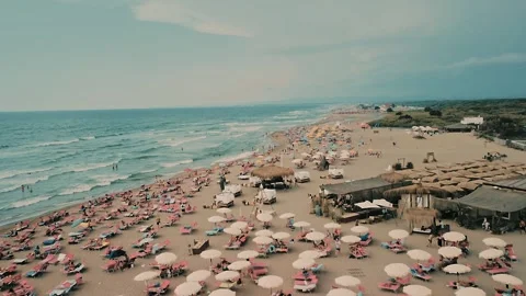 Aerial view over the sandy beach of Fregene near Rome Stock Footage 292809010