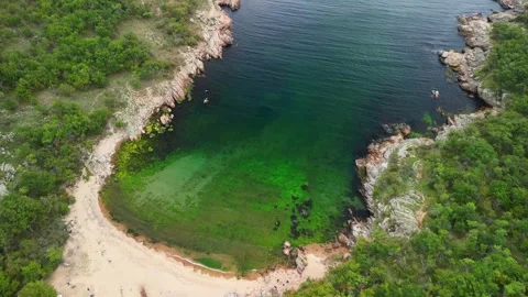 Aerial view over a small bay with a wild beach, located in the forest, Paraskeva Stock Footage 288034743