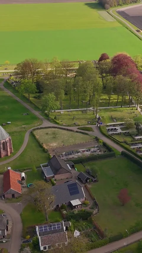 Aerial View Over Small Dutch Village With Church Vidéo 335476061
