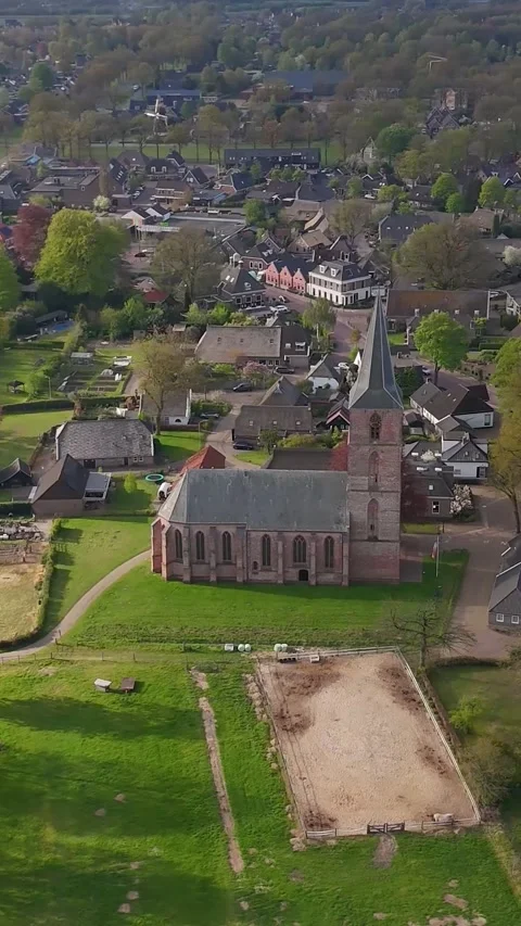 Aerial View Over Small Historic Village With Church Vidéo 335476067
