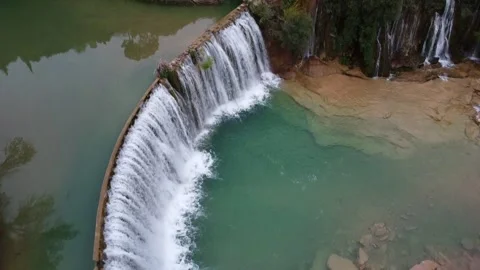 Aerial View Over Small Waterfall in Spain Stock Footage 146620451