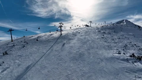 Aerial view over snowy mountain winter fo Stock Footage 310999937