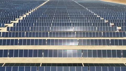 Aerial view over solar panels at solar farm producing sustainable energy Stock Footage 204123080
