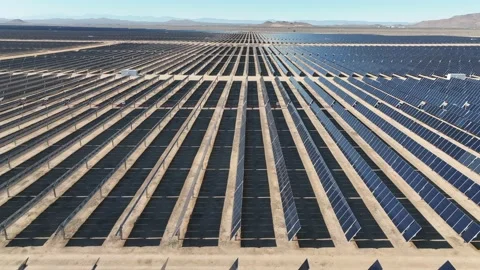 Aerial view over solar panels at solar farm producing sustainable green energy Stock Footage 204123138