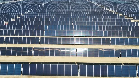 Aerial view over solar panels at solar farm producing sustainable energy Stock Footage 204123139