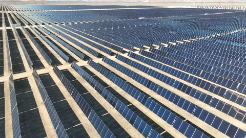 Aerial view over solar panels at solar farm producing sustainable energy Stock Footage 204123190