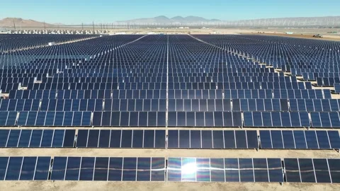 Aerial view over solar panels at solar farm producing sustainable energy Stock Footage 204123221