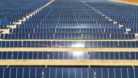 Aerial view over solar panels at solar farm producing sustainable energy Stock Footage 204759137