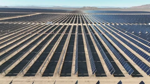 Aerial view over solar panels at solar farm producing sustainable energy Stock Footage 204759166