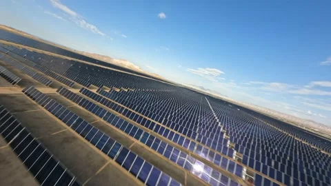 Aerial view over solar panels at solar farm producing sustainable energy Stock Footage 205314759