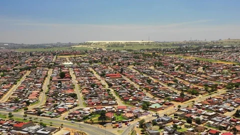 Aerial view over Soweto township outside Johannesburg in South Africa Stock Footage
