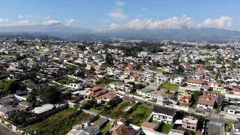 Aerial view over a suburb of Quito, Ecuador, Valle de Los Chillos. Stock Footage 128992173