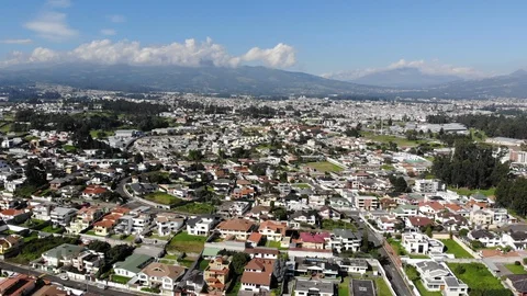 Aerial view over a suburb of Quito, Ecuador, Valle de Los Chillos. Stock Footage 128992220