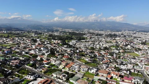 Aerial view over a suburb of Quito, Ecuador, Valle de Los Chillos. Stock Footage 128992584