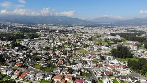Aerial view over a suburb of Quito, Ecuador, Valle de Los Chillos. Stock Footage 128992861