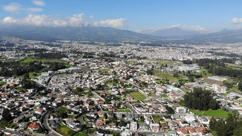 Aerial view over a suburb of Quito, Ecuador, Valle de Los Chillos. Stock Footage 128993247