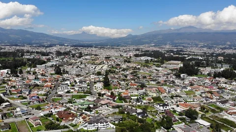 Aerial view over a suburb of Quito, Ecuador, Valle de Los Chillos. Stock Footage 128993704