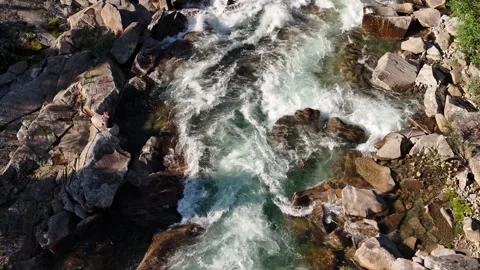Aerial View Over The Surface Of A Mountain River . Camera move down Stock Footage 256051033