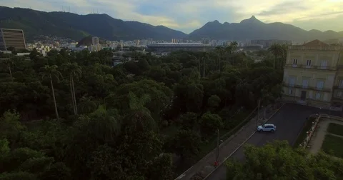 Aerial view over trees to see the Maracanﾠ Stadium in Rio De Janeiro. Brazil. 스톡 동영상 77821938
