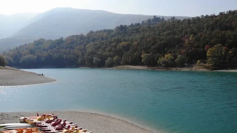 Aerial view over a turquoise river in Italy Stock Footage 113200645