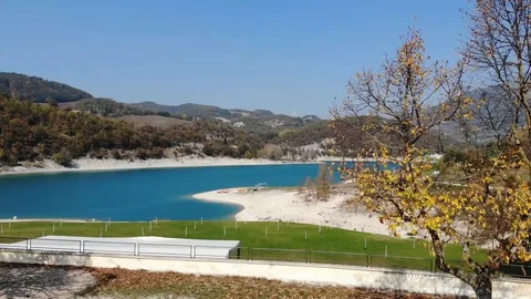 Aerial view over a turquoise river in Italy Stock Footage 113200646