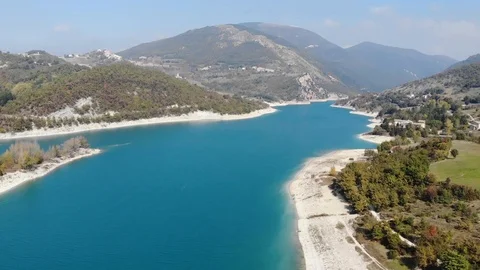 Aerial view over a turquoise river in Italy Stock Footage 113200647