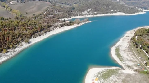 Aerial view over a turquoise river in Italy Stock Footage 113200660