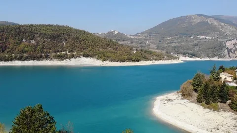 Aerial view over a turquoise river in Italy Stock Footage 113200663