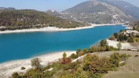 Aerial view over a turquoise river in Italy Stock Footage 113200670