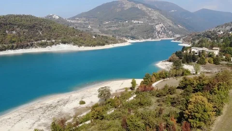 Aerial view over a turquoise river in Italy Stock Footage 113200675