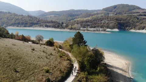 Aerial view over a turquoise river in Italy Stock Footage 113204484