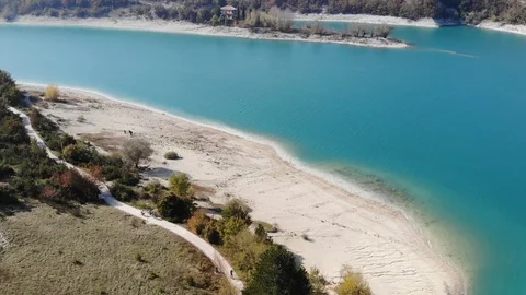 Aerial view over a turquoise river in Italy Stock Footage 113204528