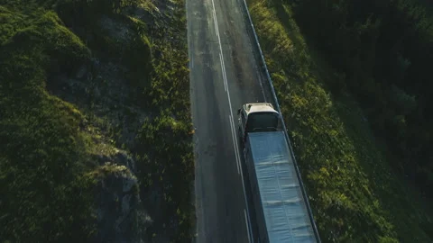 Aerial view of over two-line road with cargo truck lorry moving to logistics Stock Footage 157762720