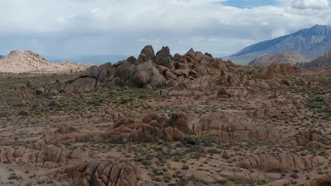 Aerial view over unique rock formation at Alabama Hills in California Stock Footage 110824696