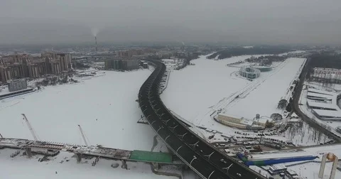 Aerial view over vehicles passing near World Cup stadium construction in 2018 Stock Footage 72624977