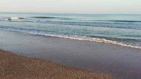 Aerial view over the waves of the sea on a beach Stock Footage 200213019