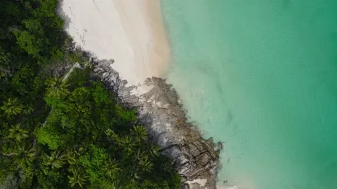Aerial view over white beach sand and sew water clear Stock Footage 172391754
